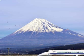 A bullet train passes below Mt. Fuji in Japan.