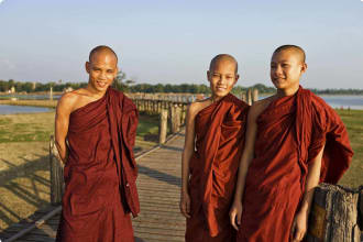 Buddhist Monks crossing U Bein Bridge
