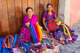 Women selling textiles and souvenirs Antigua Guatemala