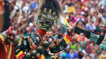 Masked dance is one of the main attractions during annual festivals or Tshechu in Bhutan. It shows vibrant and unique cultural heritage.