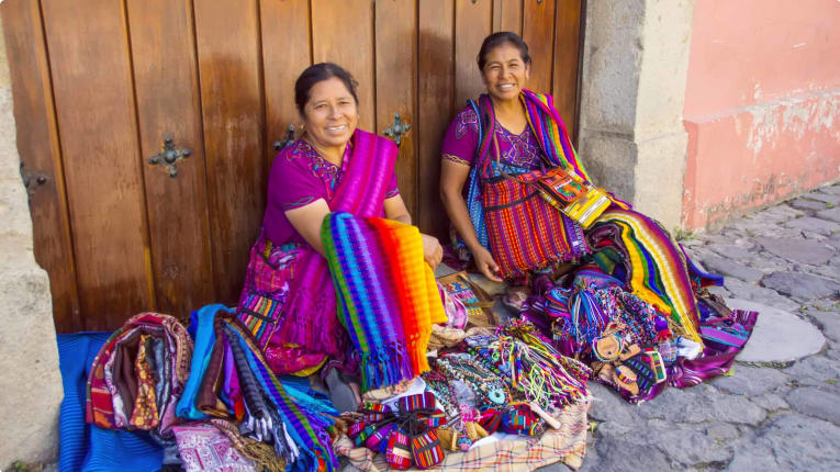 Mayan women selling handmade textiles and souvenirs, Antigua, Guatemala