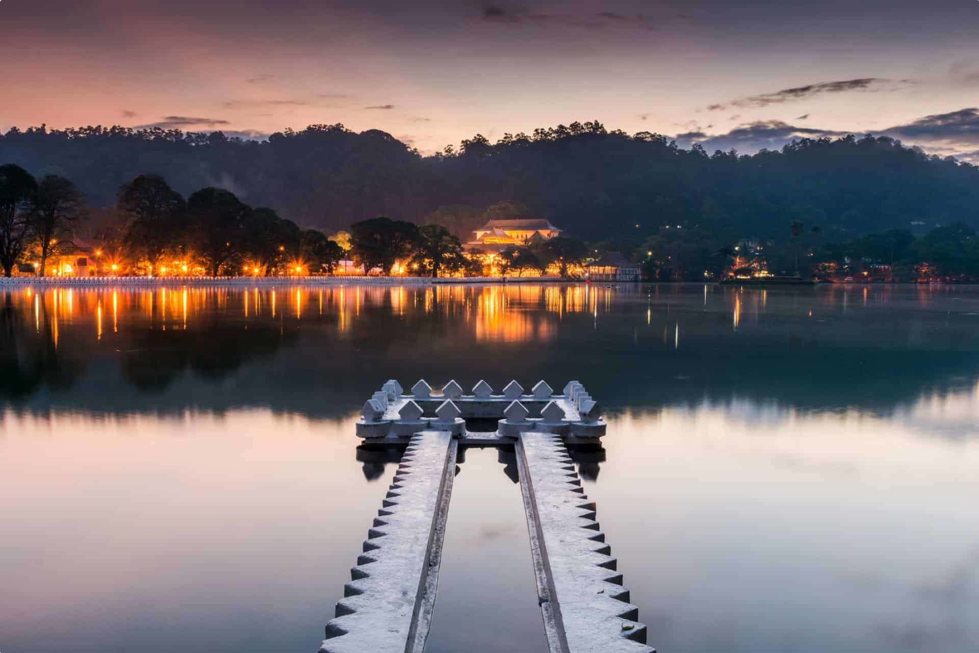 Kandy Lake and the Temple of the Sacred Tooth Relic (Sri Dalada Maligawa) at sunrise, Kandy, Sri Lanka