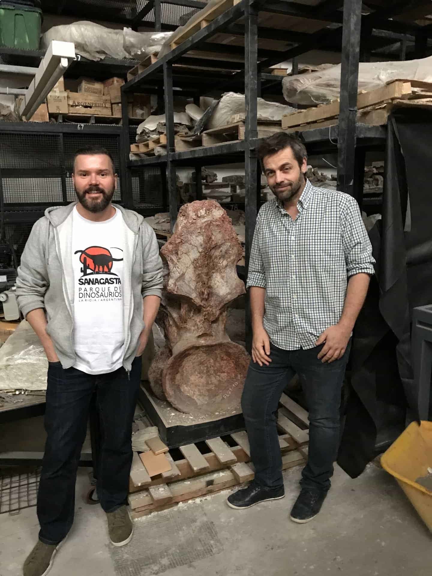 John and Dr Diego Pol with a backbone from Patagotitan, the largest of all known dinosaurs 