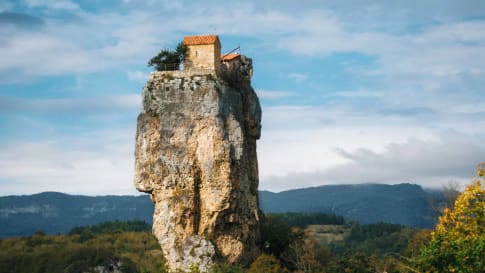 Katskhi pillar. Georgian landmarks. Man's monastery near the village of Katskhi. The orthodox church and the abbot cell on a rocky cliff. Imereti, Georgia. Georgian Meteora