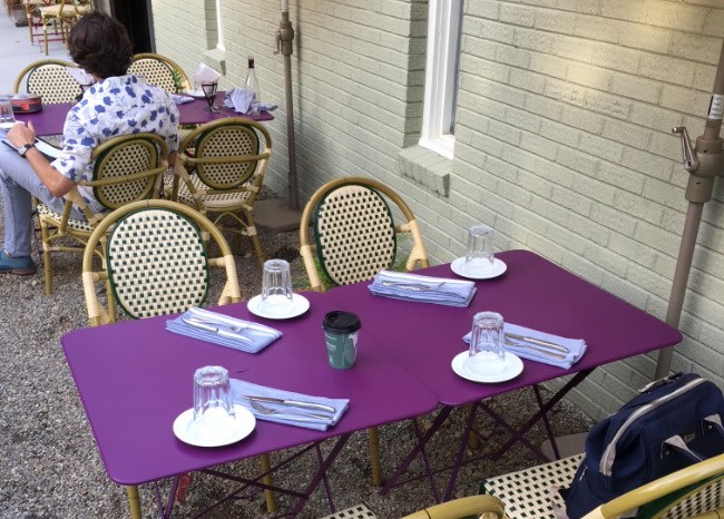 RendezVous purple table and wicker chairs