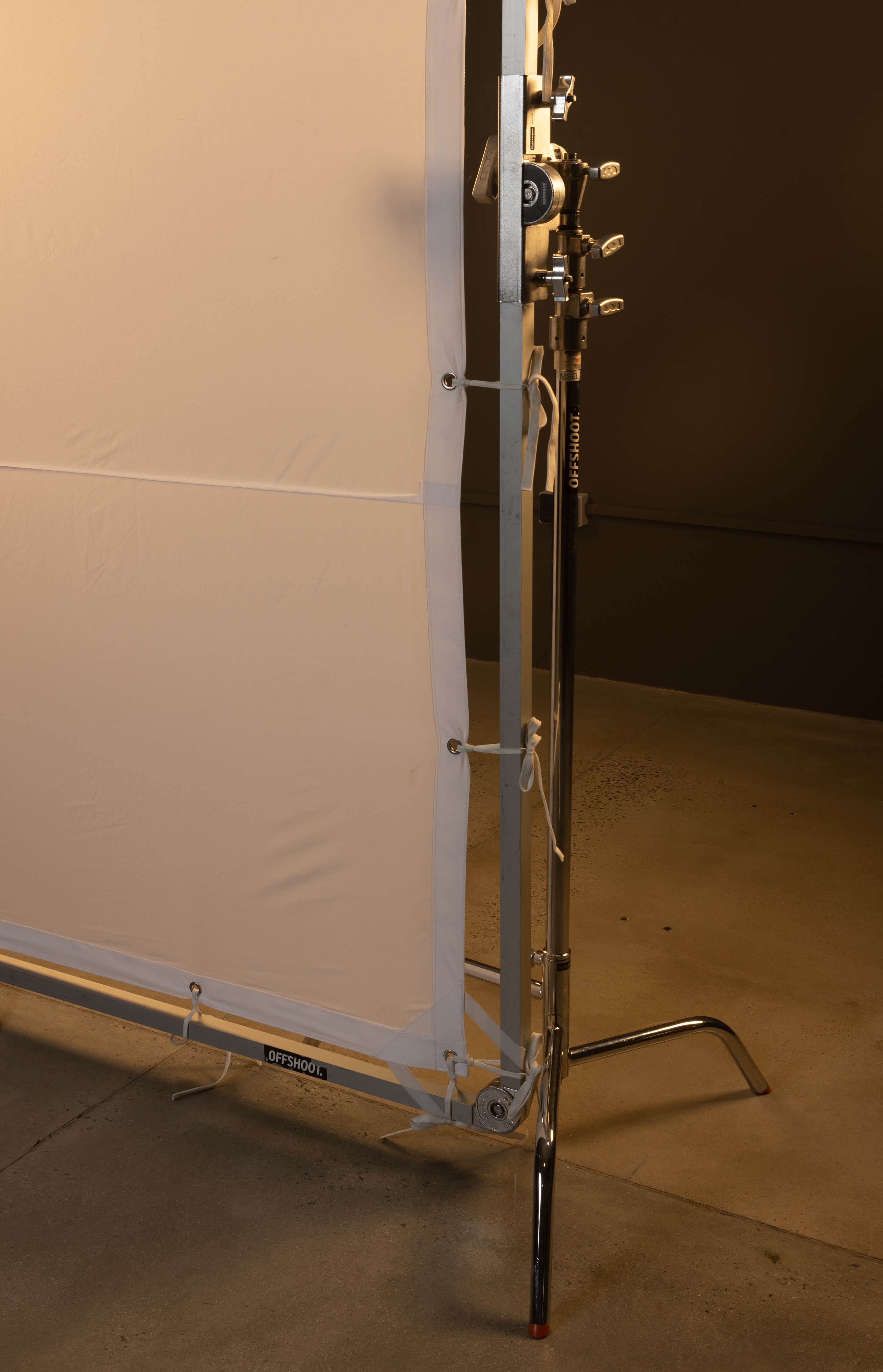 The H2508 8x8 frame mounted to the 5/8" (baby) spigot of a c-stand.