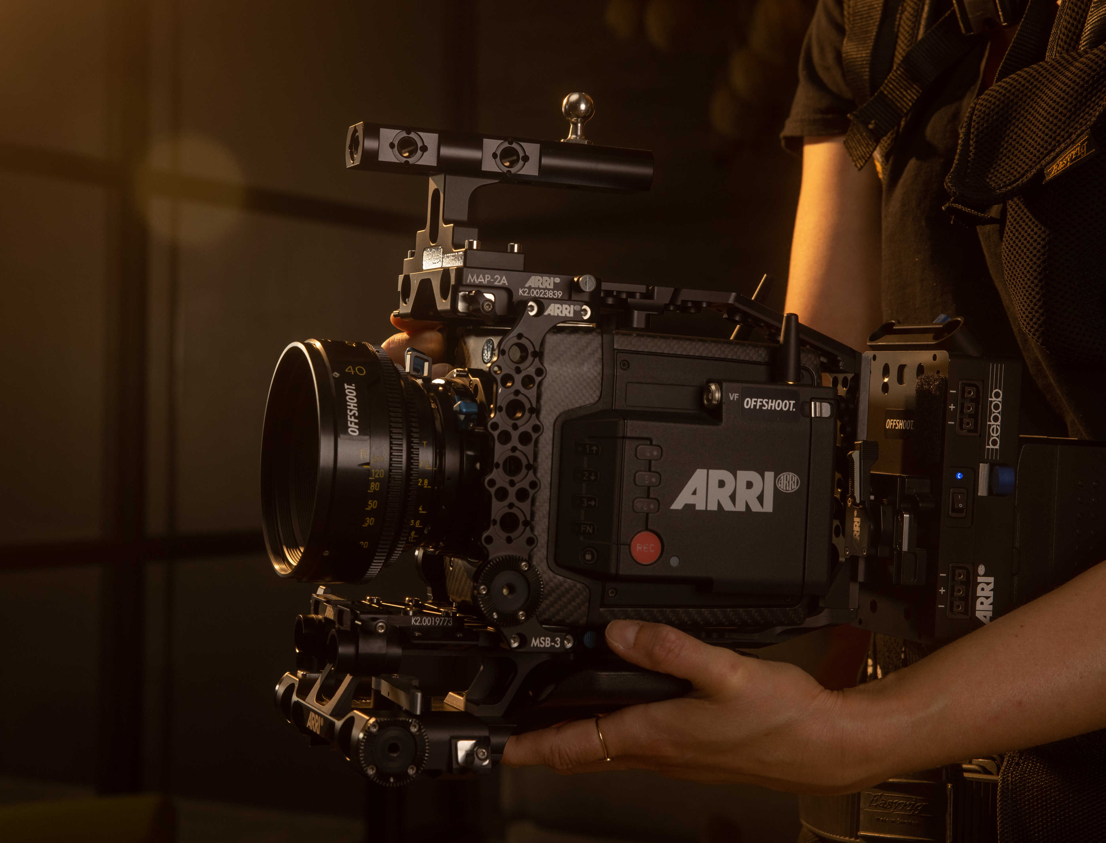 A 3/8" ball stud screwed into an Arri top handle of an Arri Alexa Mini LF camera.