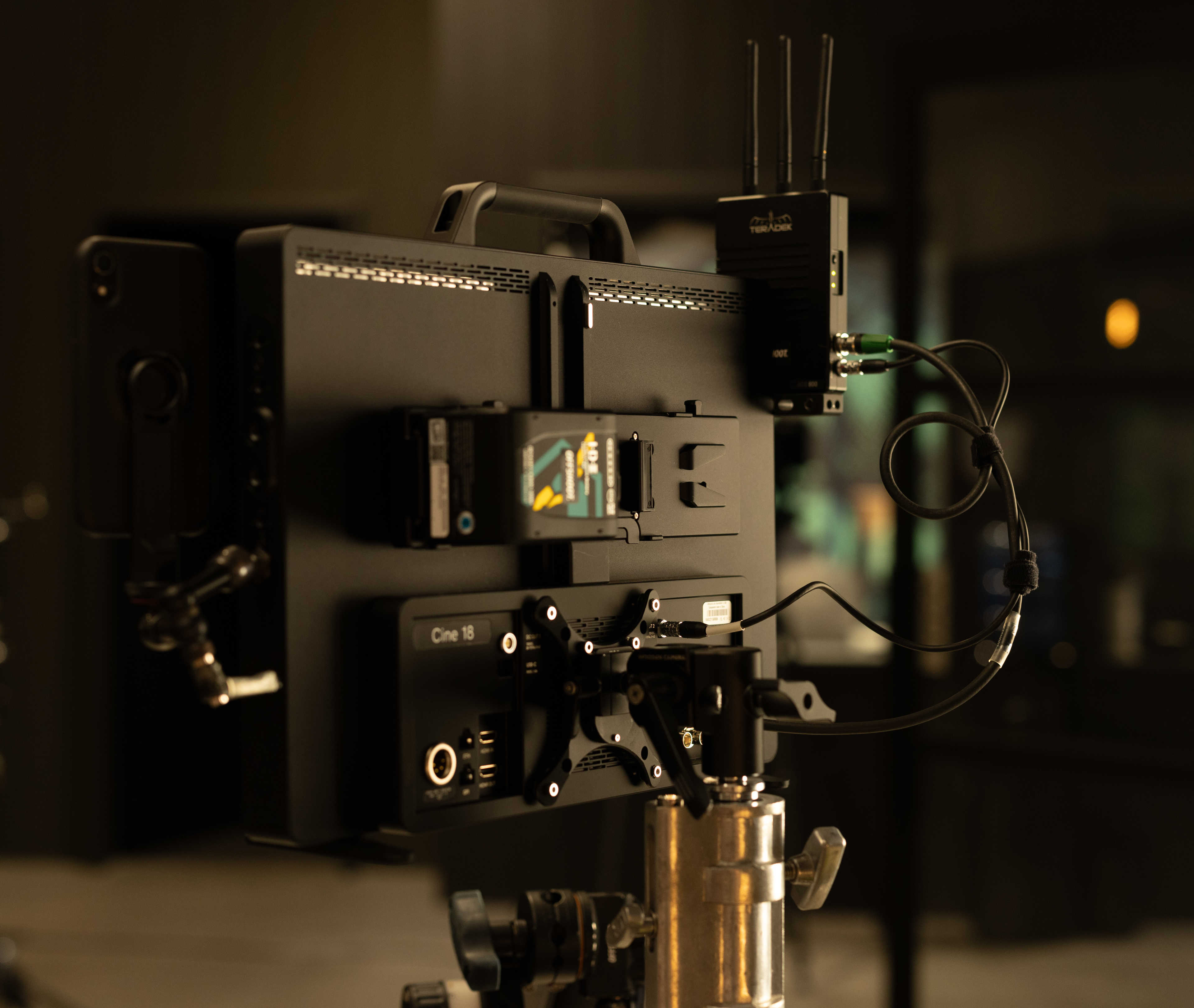 The SmallHD Cine 18 4K monitor mounted to a combo stand via the included Wooden Camera VESA mount.