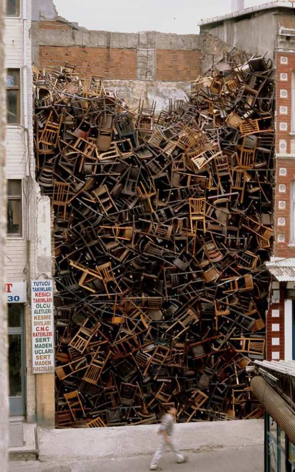 Doris Salcedo: 1550 Chairs Stacked Between Two City Building