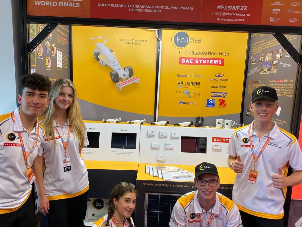 Team Eclipse in front of their pit display at the 2022 F1 in Schools World Finals.