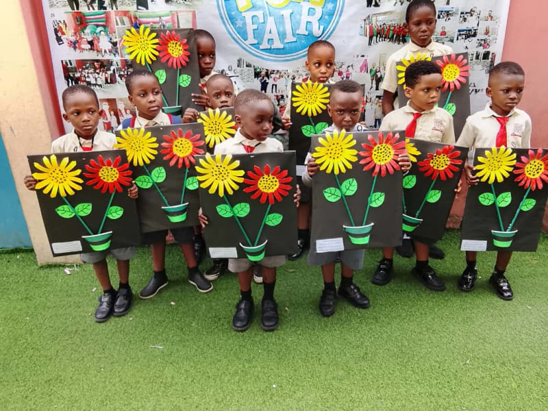 Pupils with flower crafts at the school Art Fair