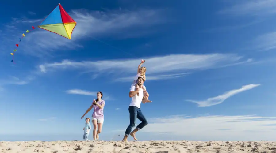 family-flying-kite-clean-monday-on-beach-Crete