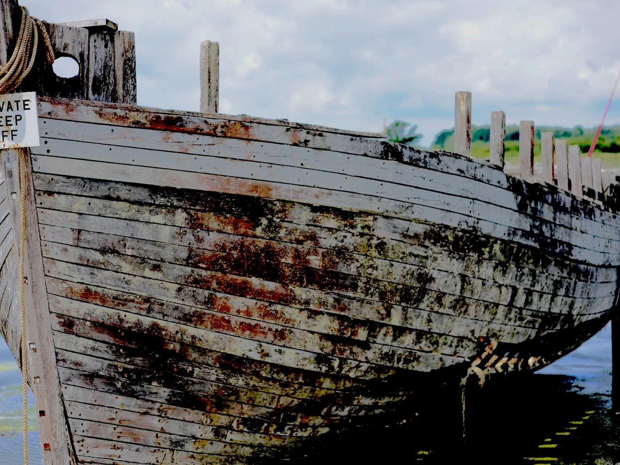 An image of an old white ship that is docked by @keithrpotts on unsplash.