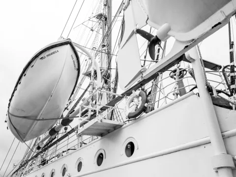 An image of a sailing ship in grayscale, by @turbaszek on unsplash.