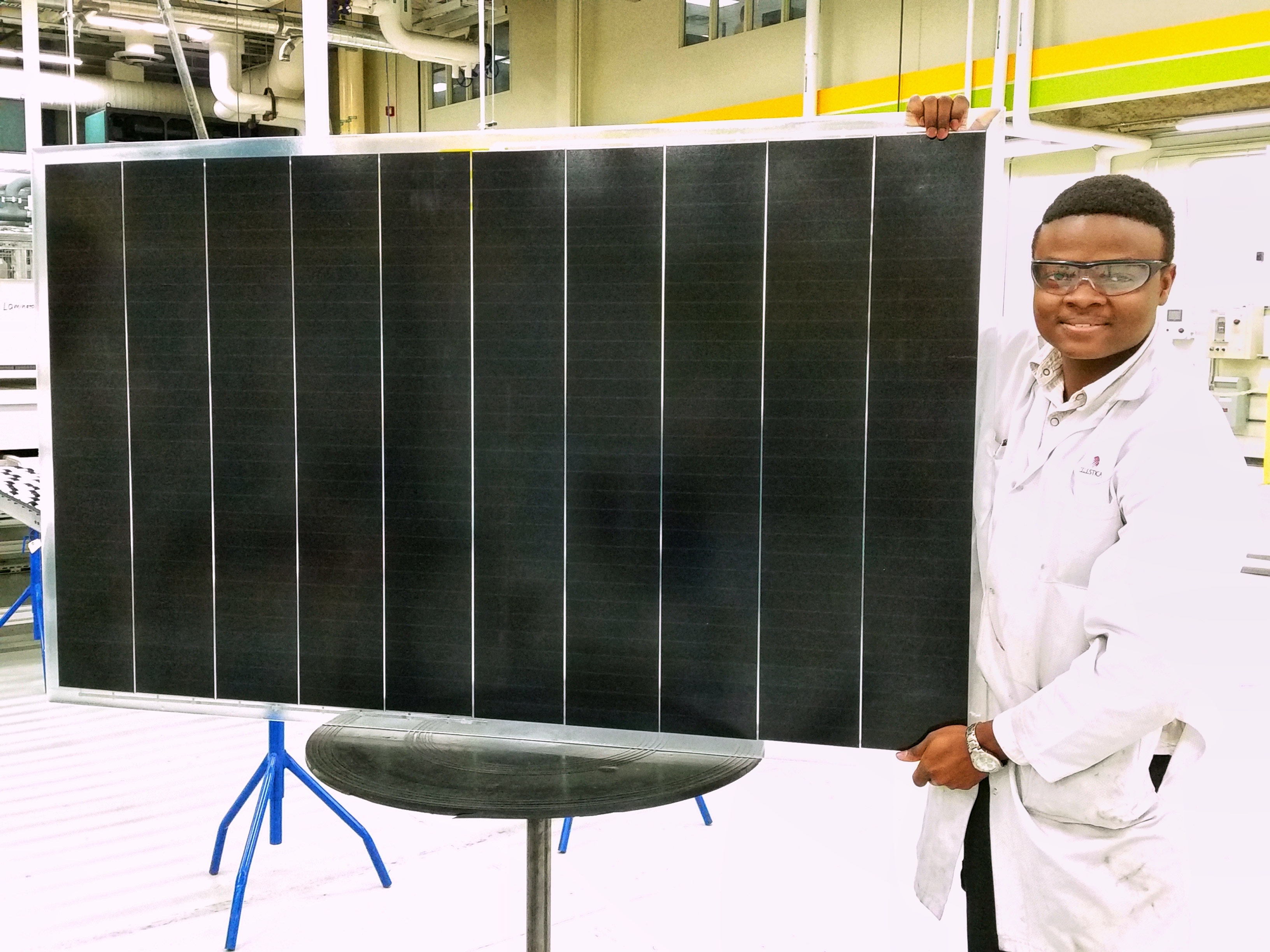 Image of Joseph Ojo holding a phoenix frame based solar panel