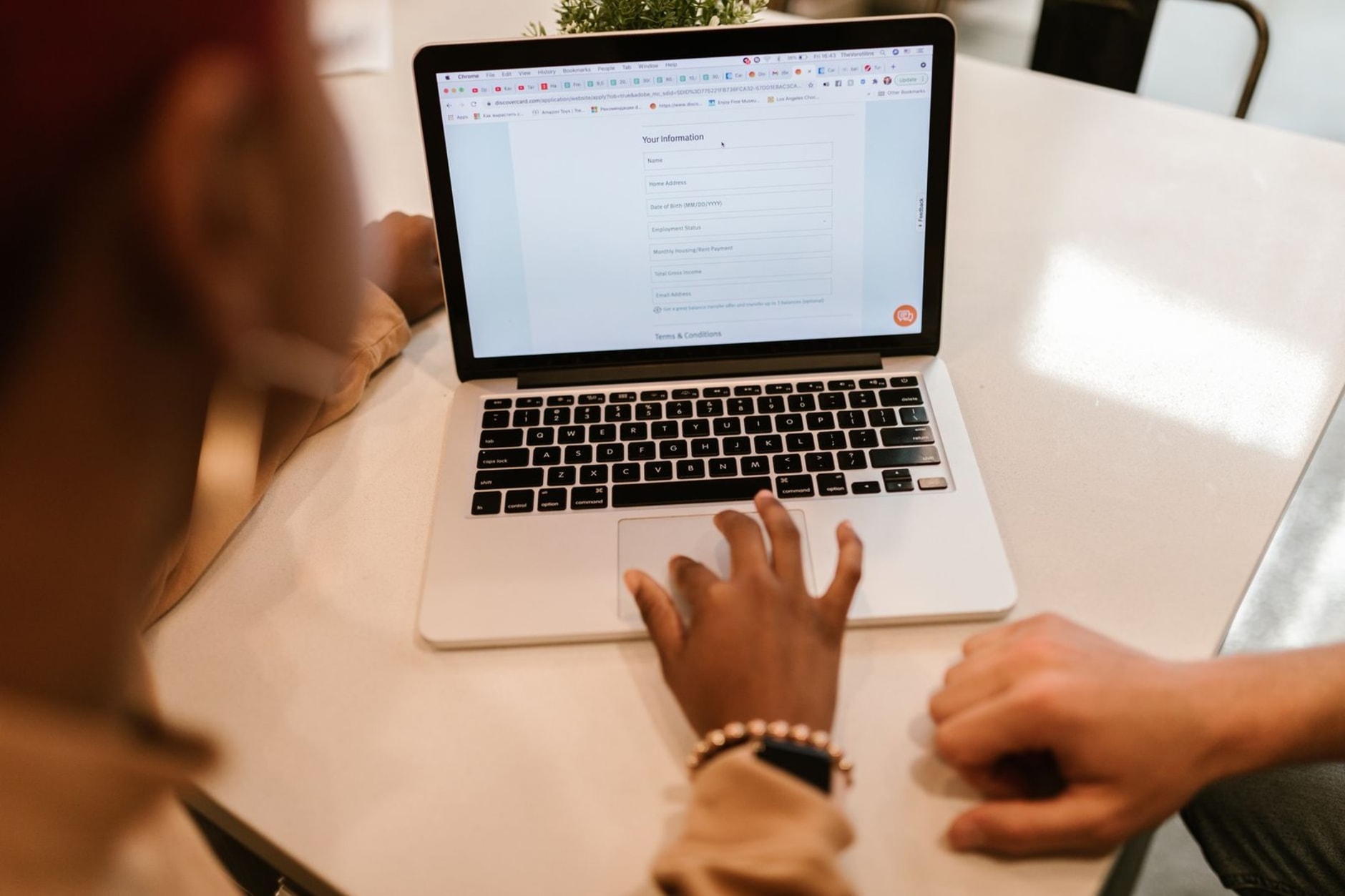Customer filling out an online quote request form on a laptop