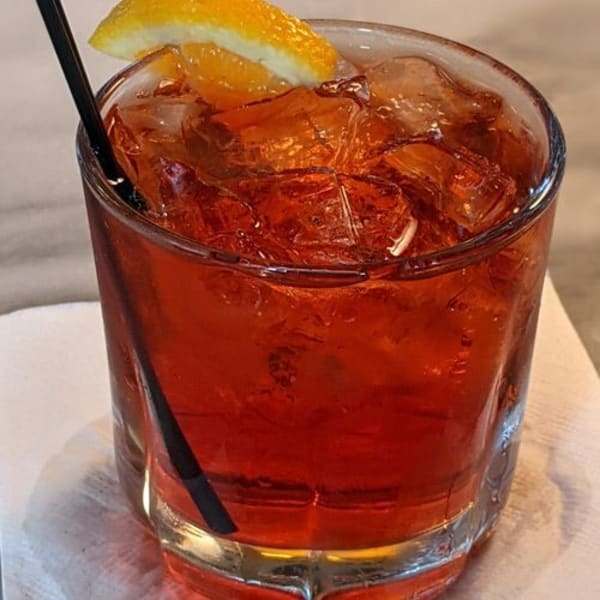 A classic Negroni over ice with an orange peel