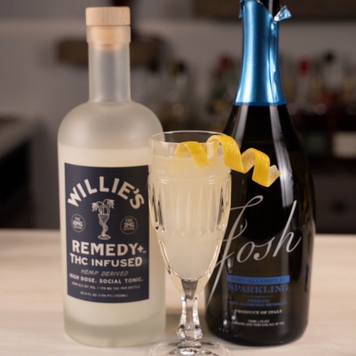 Willie's Remedy French 420 in a champagne flute with lemon twist