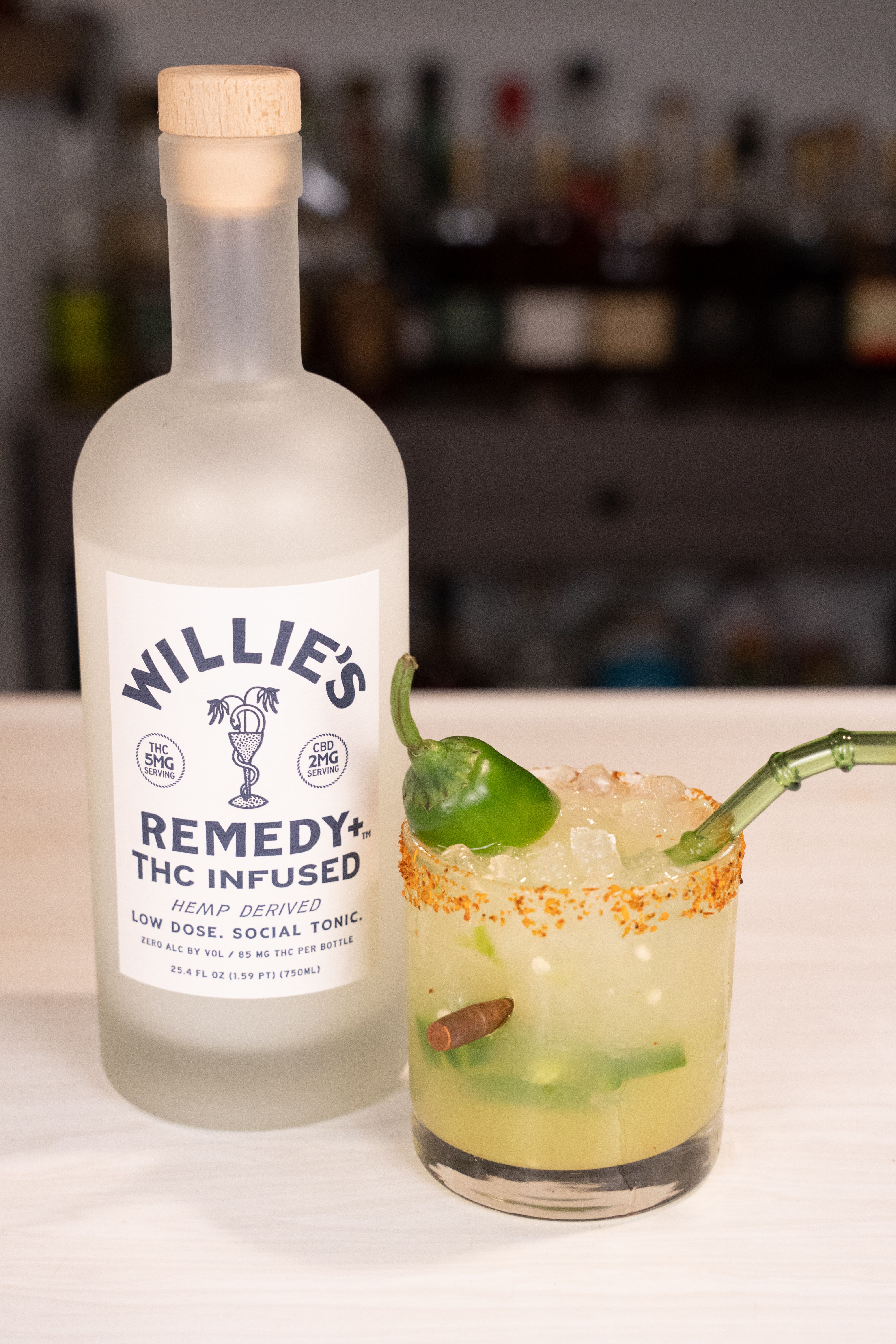 Willie's Remedy bottle next to a spicy margarita