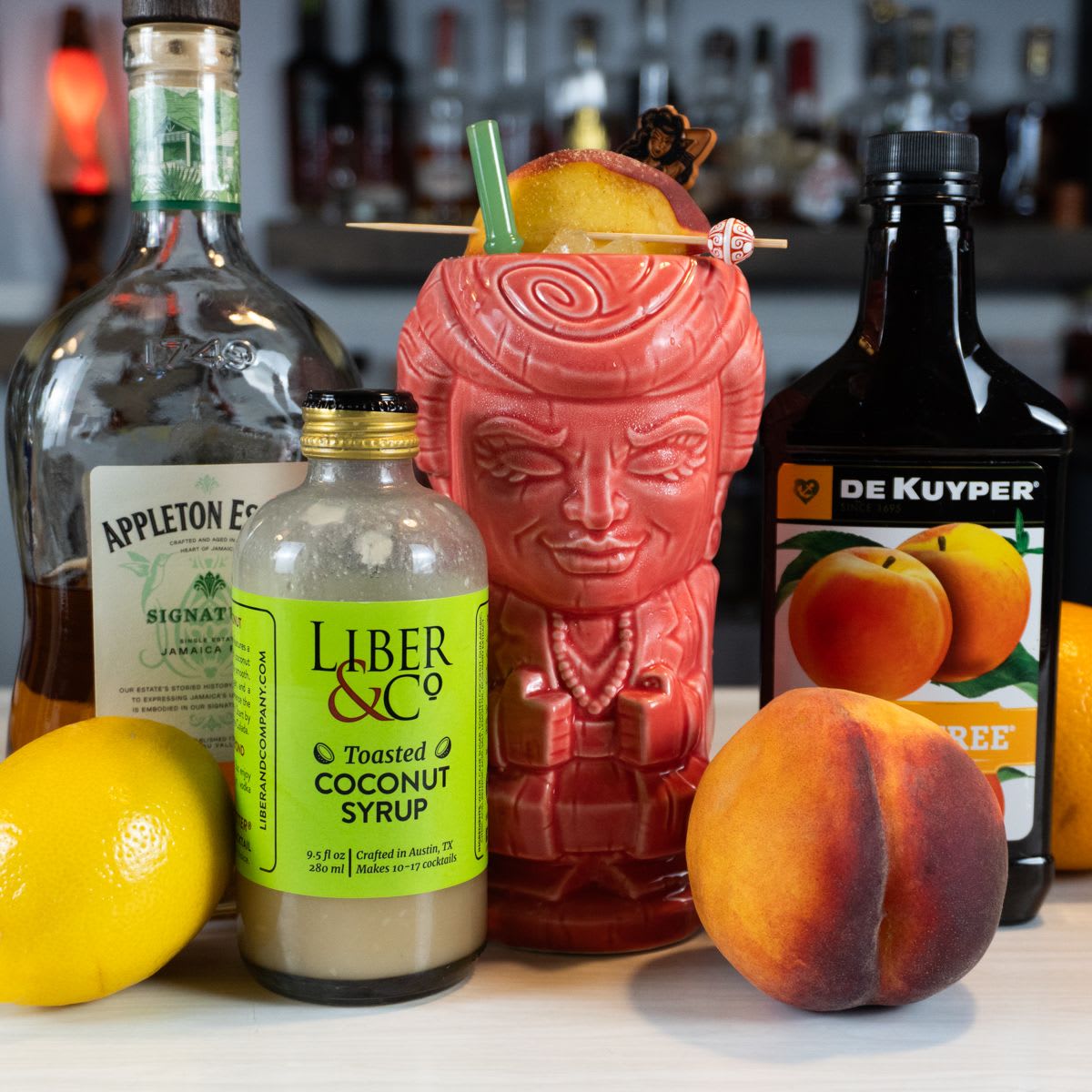 Peachtree Punch 2.0 in a Blanche Devereaux Golden Girls tiki mug with Appleton rum, fresh peach, and coconut syrup