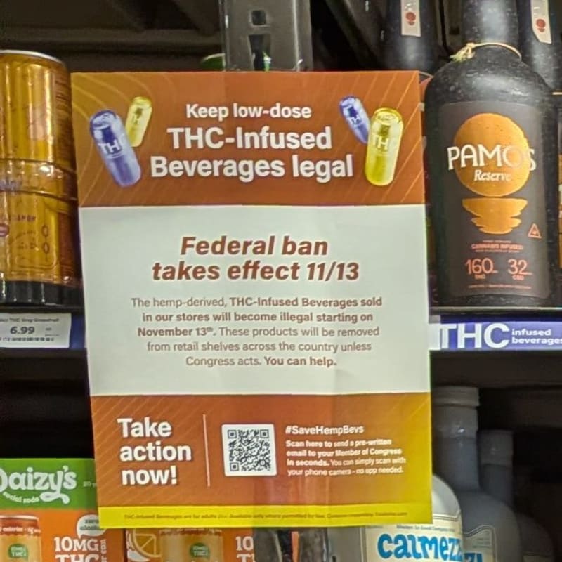 Total Wine shelf sign: Keep low-dose THC-Infused Beverages legal, federal ban takes effect 11/13, with a QR code to contact Congress