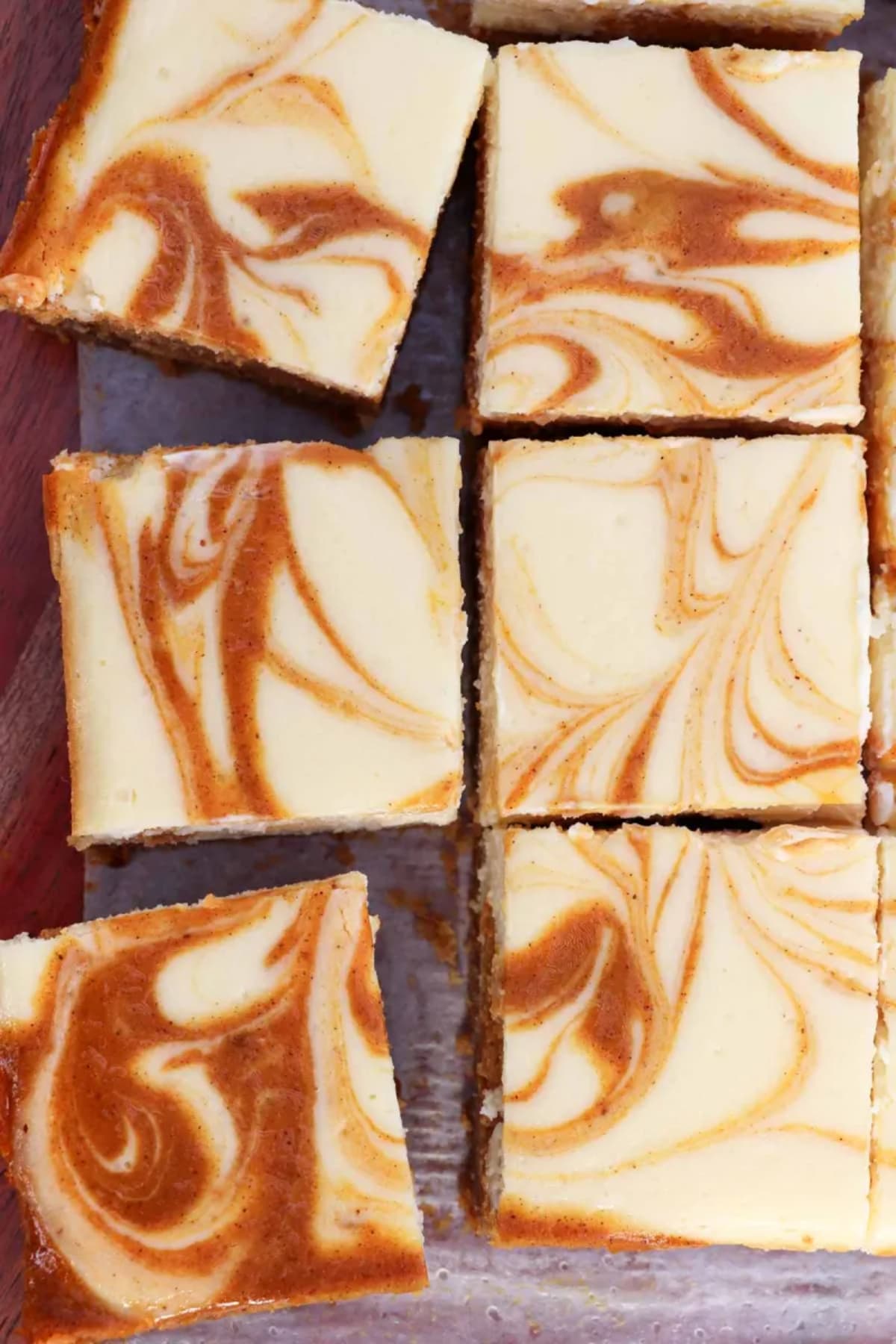 The Best Pumpkin Swirl Cheesecake Bars