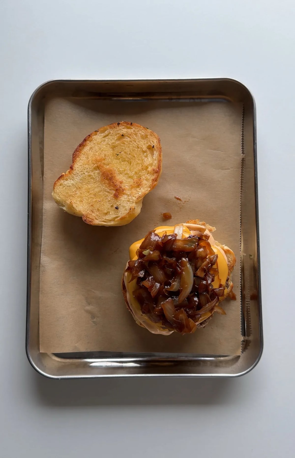 Garlic Knot Double Smash Burger with Caramelized Onion and Chipotle Sauce