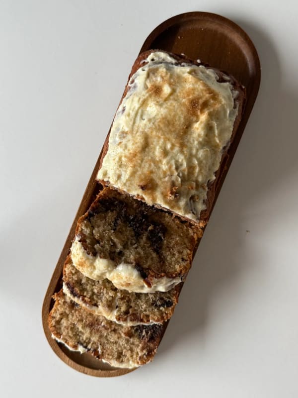 Cinnamon Roll Banana Bread with Cream Cheese Frosting cover