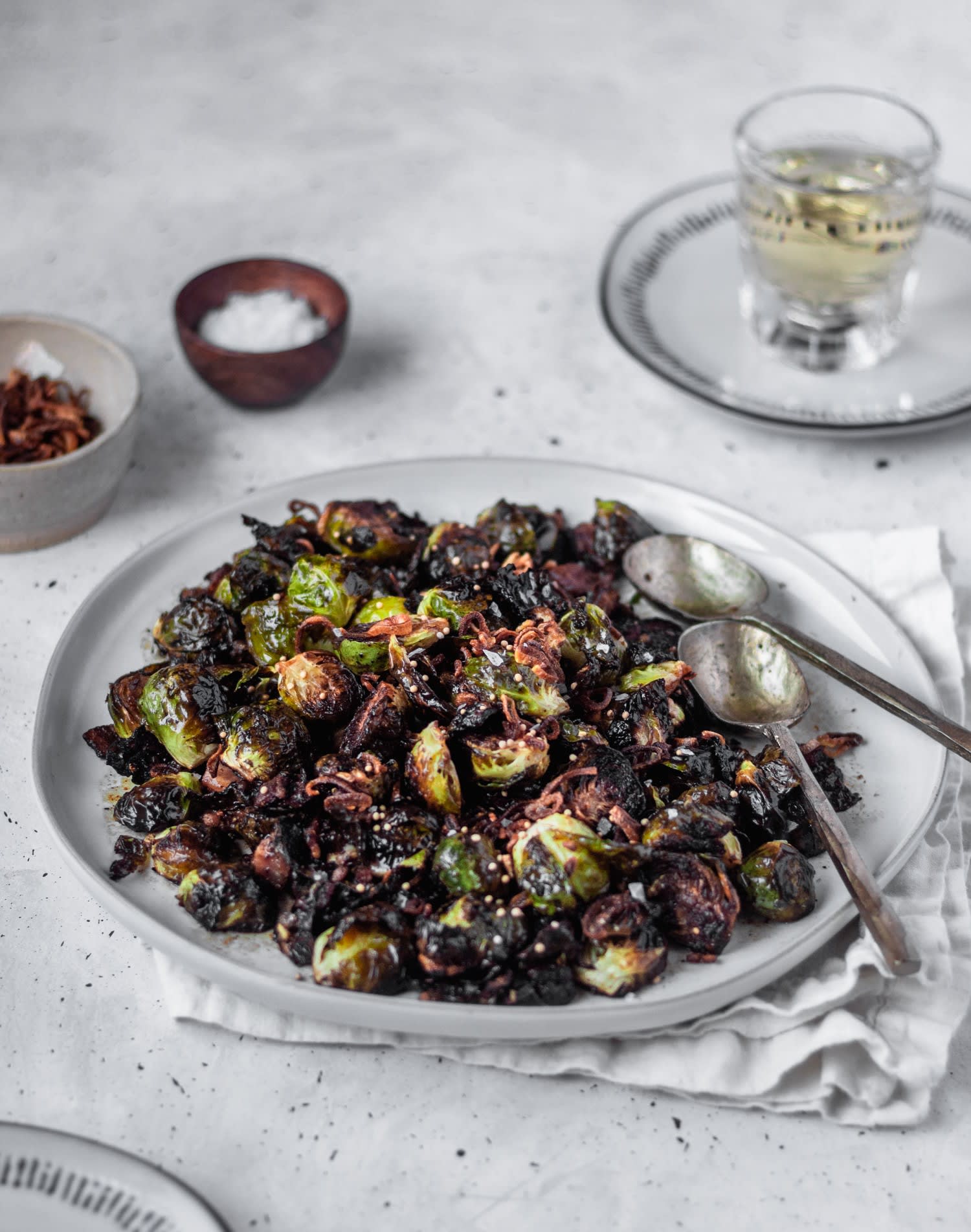 Crispy Brussels Sprouts With Fried Shallots, Bacon, & Dijon Vinaigrette