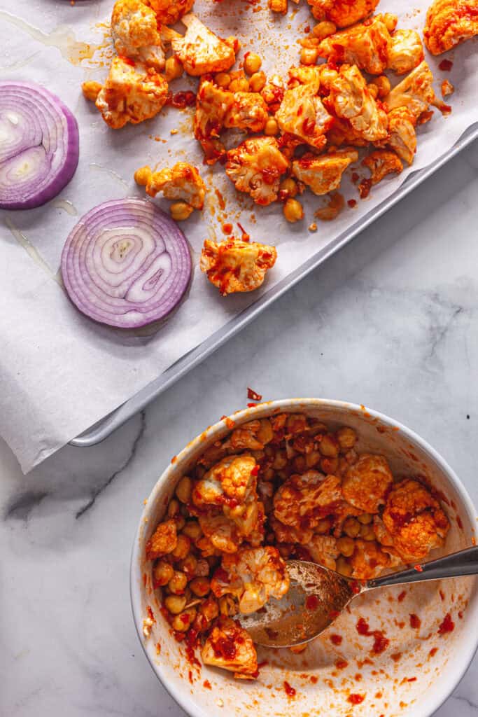 Harissa Roasted Cauliflower and Chickpeas with Tahini Sauce 