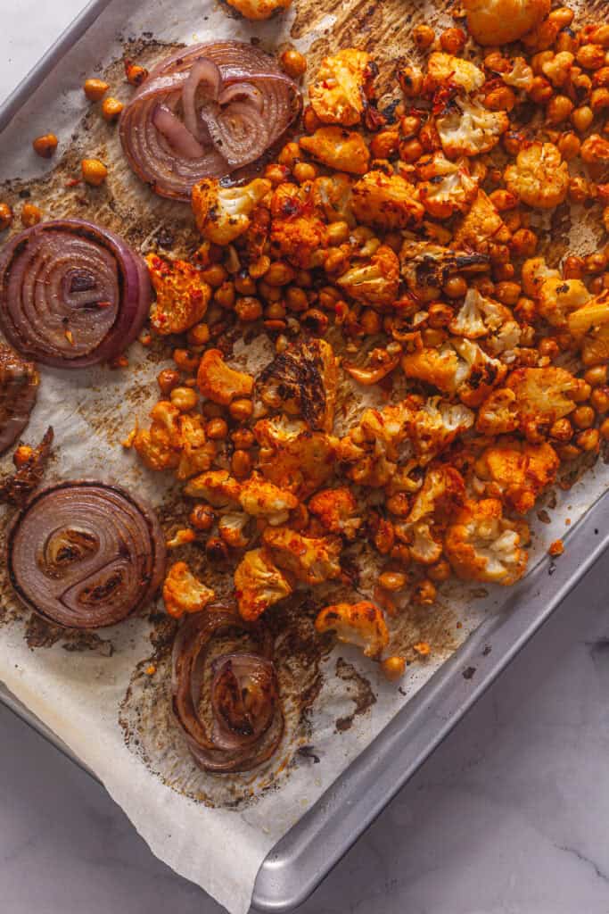 Harissa Roasted Cauliflower and Chickpeas with Tahini Sauce 