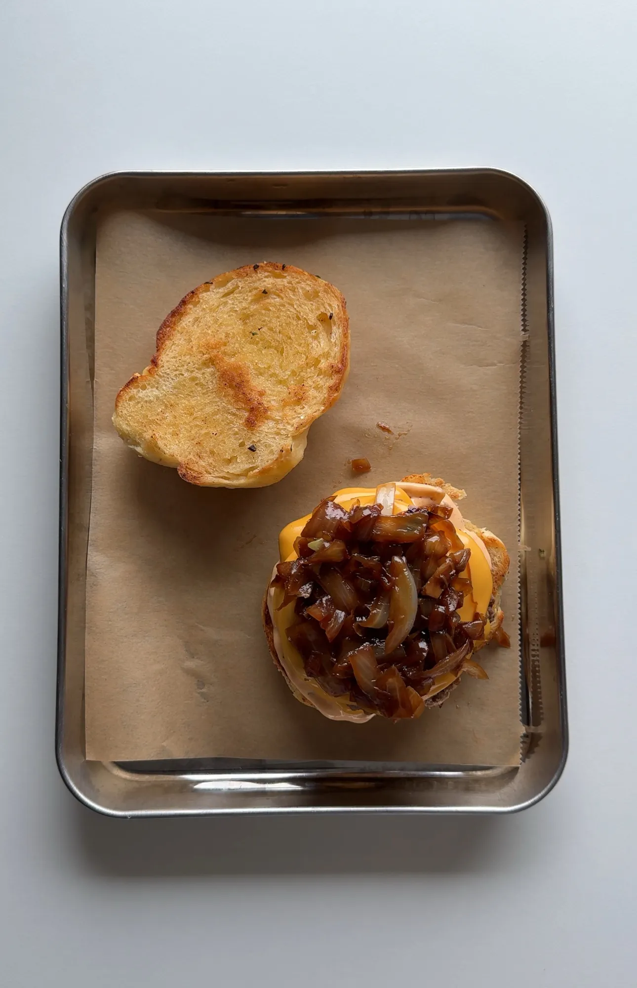 Garlic Knot Double Smash Burger with Caramelized Onion and Chipotle Sauce
