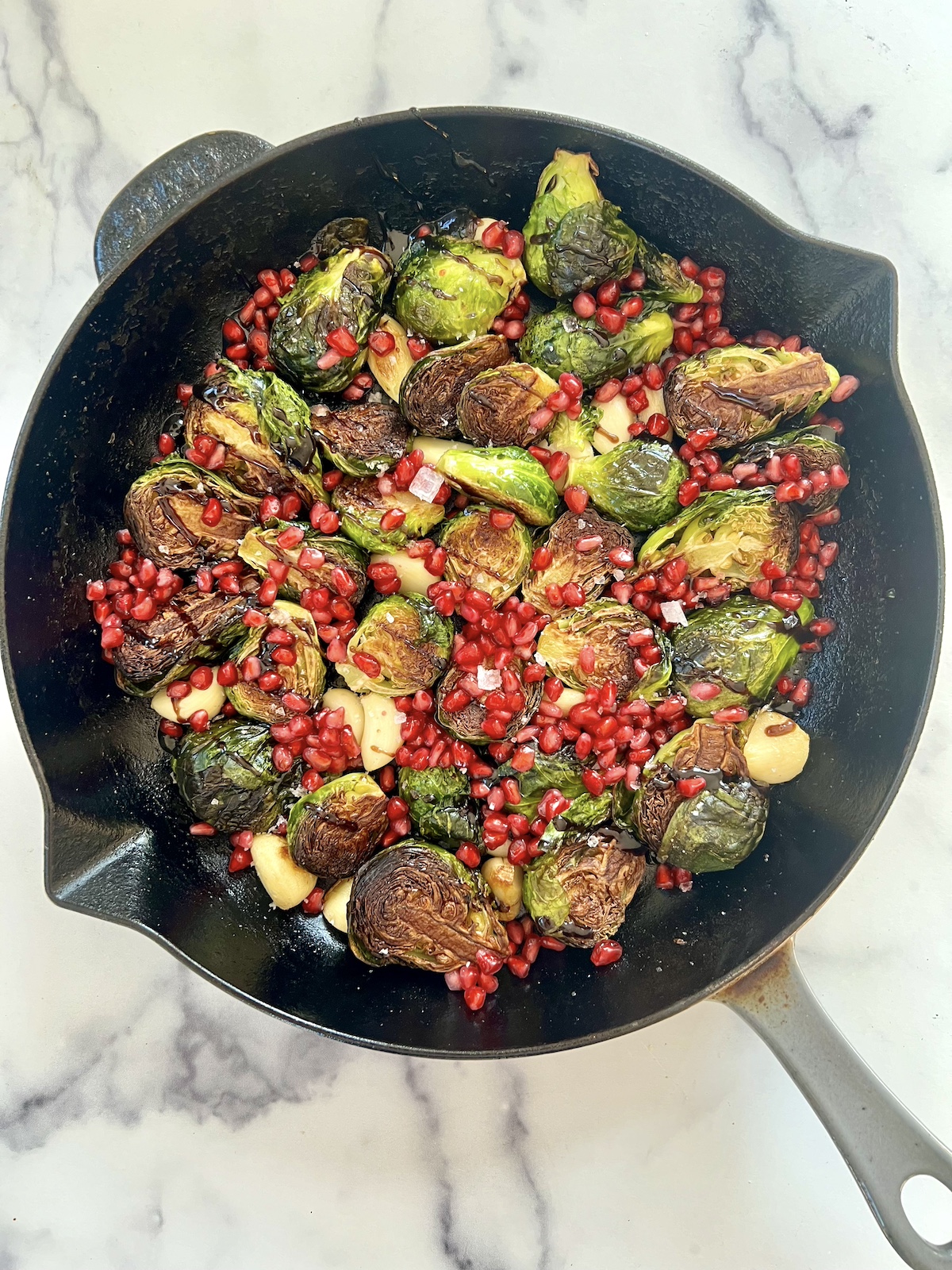 Cast Iron Brussels Sprouts with Pomegranate and Garlic
