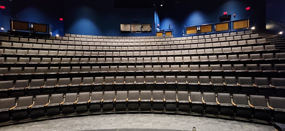 A photo of the audience seating in the Millennium Theatre 