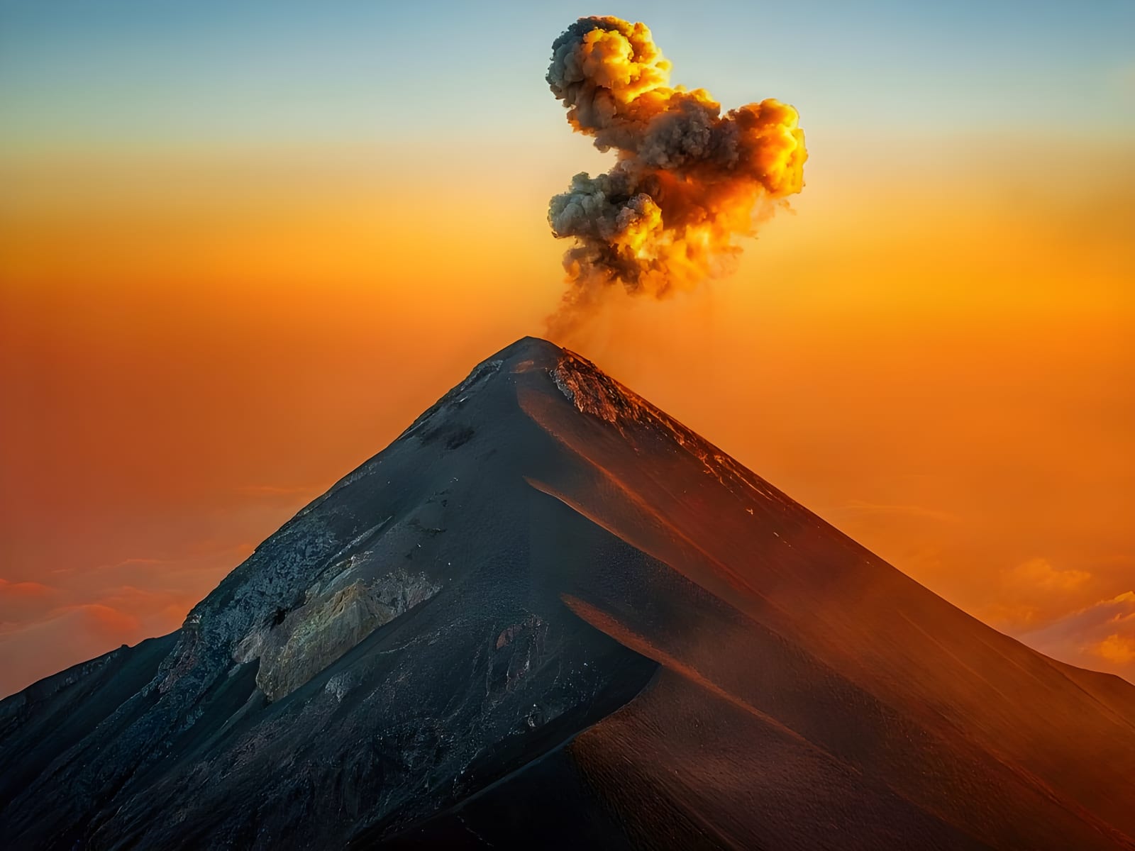 Fuego Volcano erupting at sunset