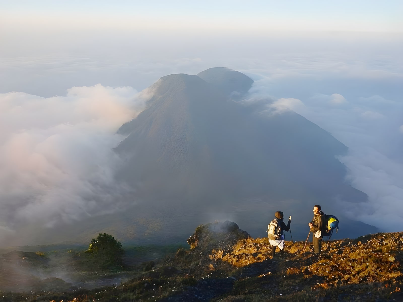 Hikers on Acatenango's summit above the clouds