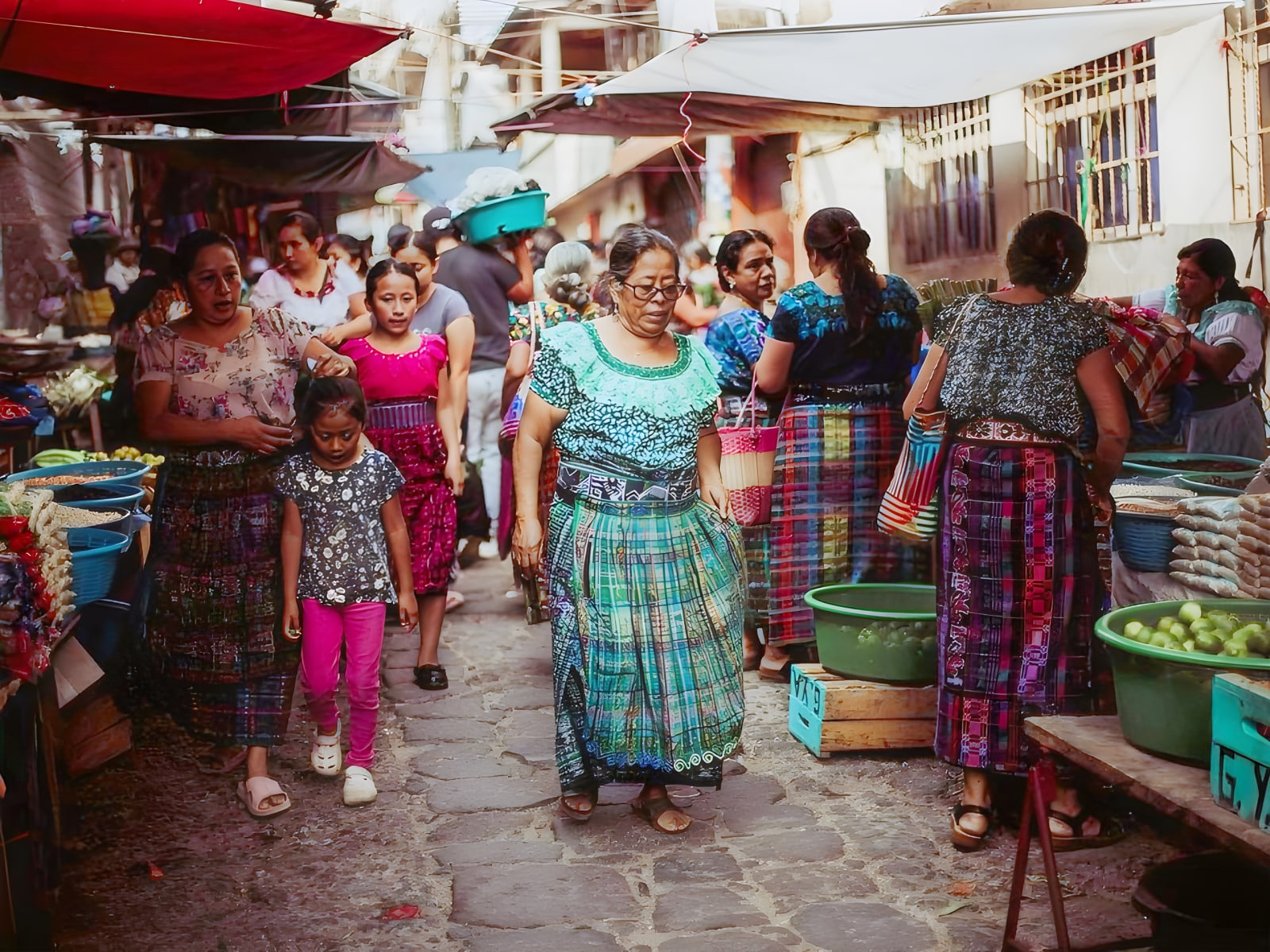 Women in traditional dress at the market