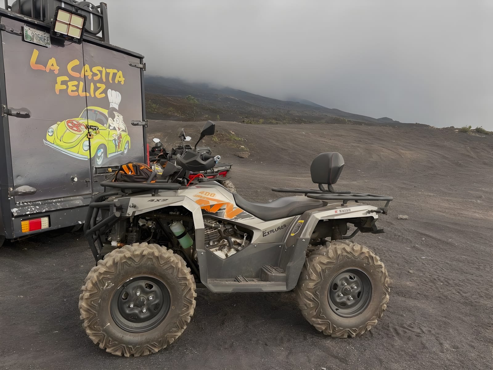 ATV on volcanic sand under the clouds