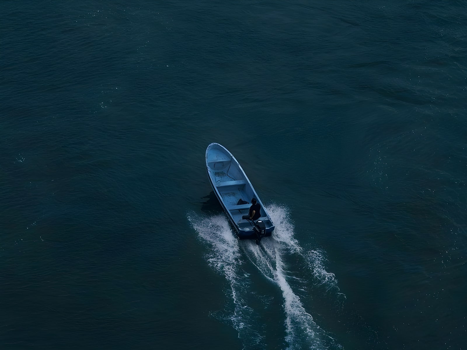 Boat on Río Dulce seen from above