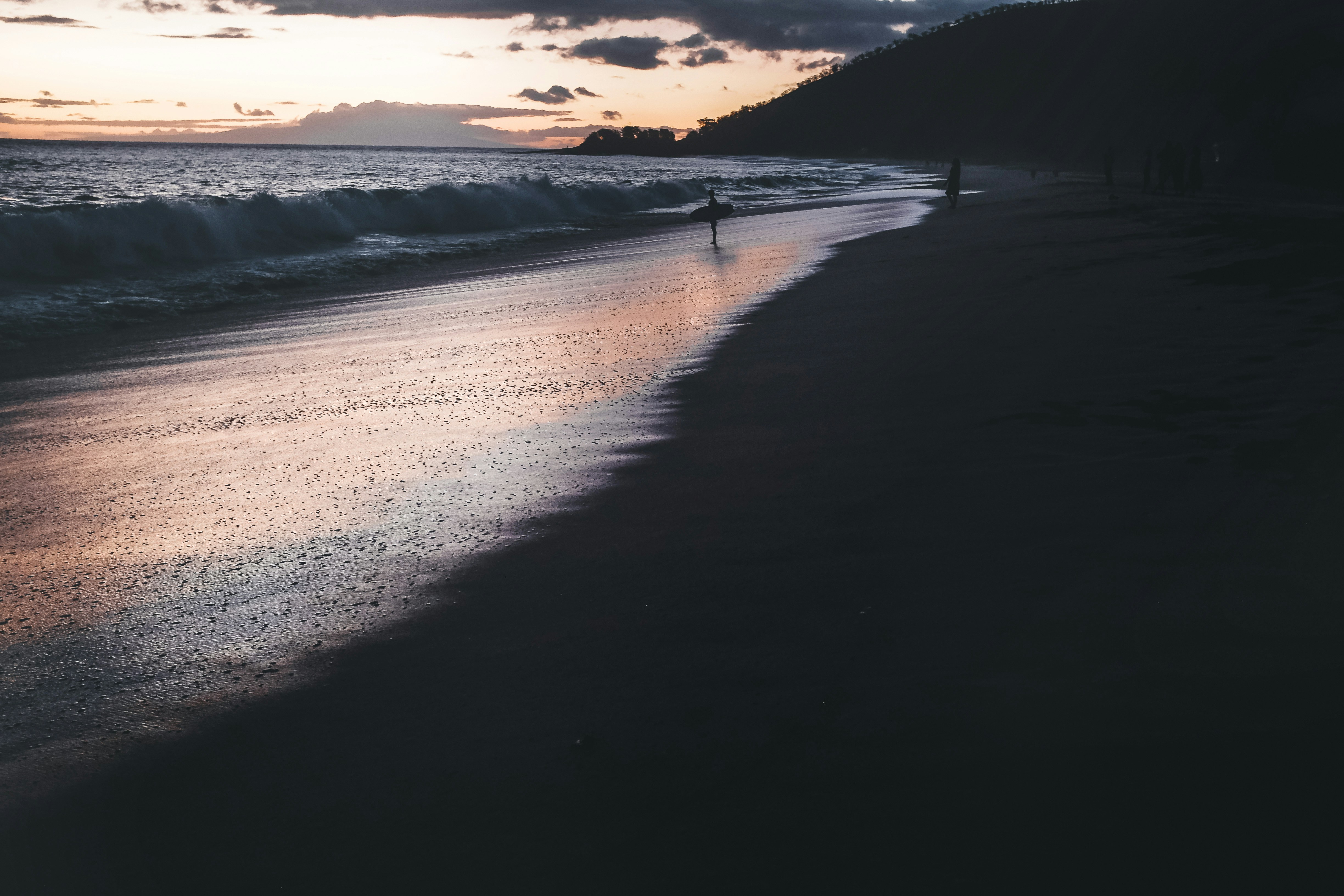 A stunning South Maui beach at sunset — the golden shoreline and turquoise water of the Makena coastline