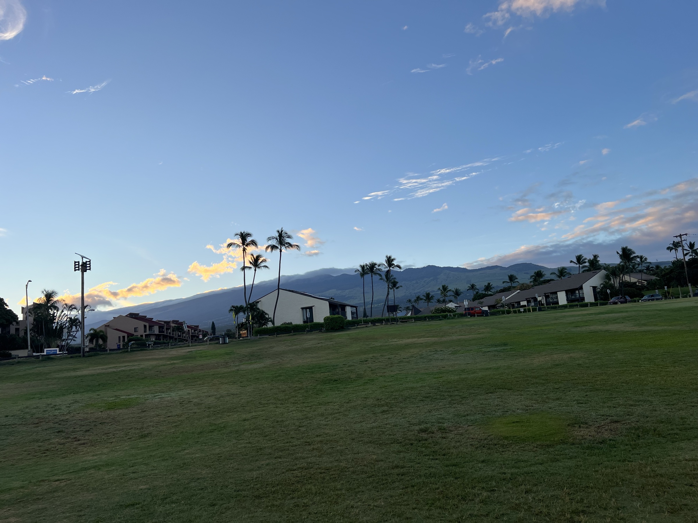 First light at Kama'ole Beach III — Haleakalā on the horizon, 5:59 AM July 1 morning walk