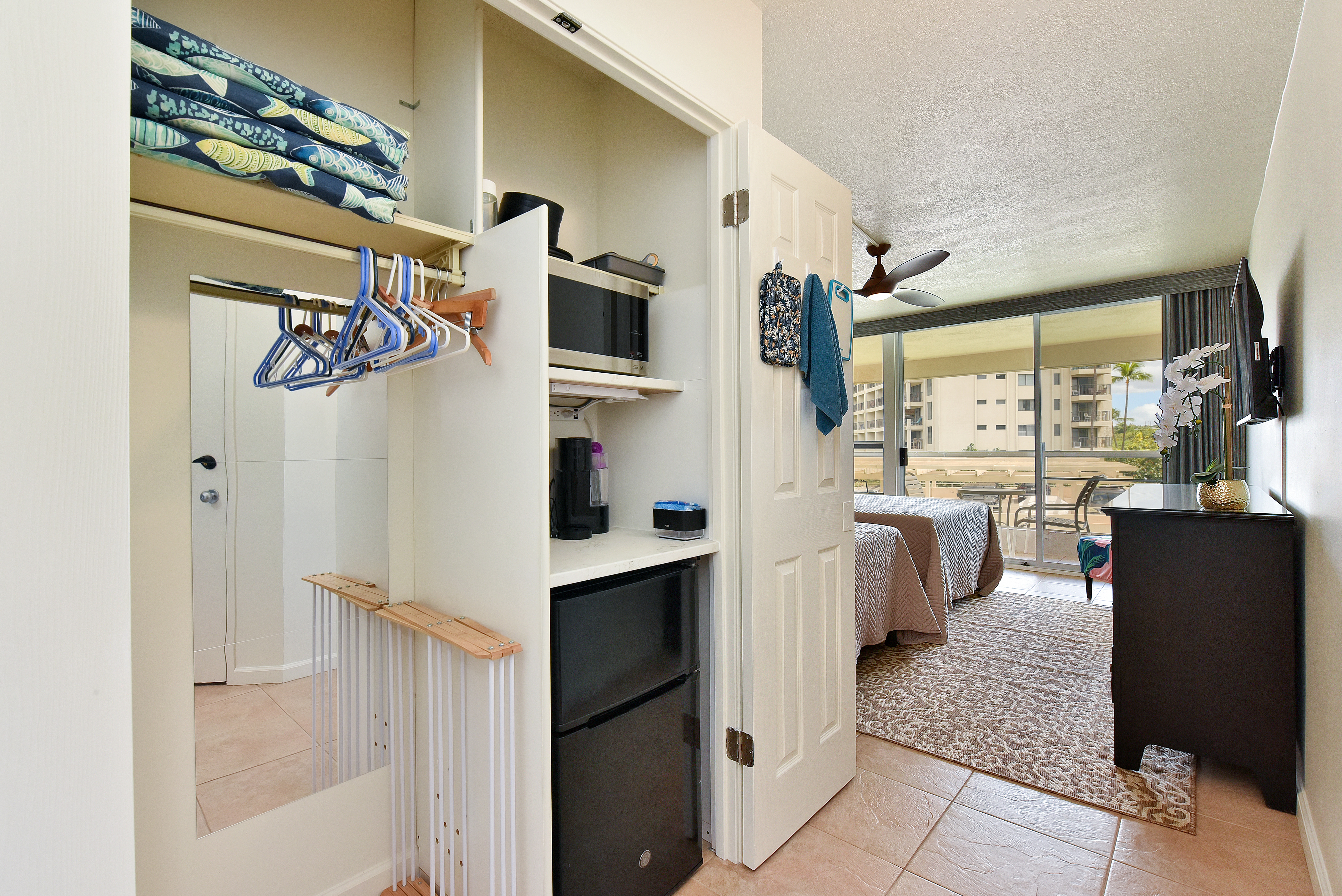Guest bedroom kitchenette — microwave, mini-fridge, coffee maker