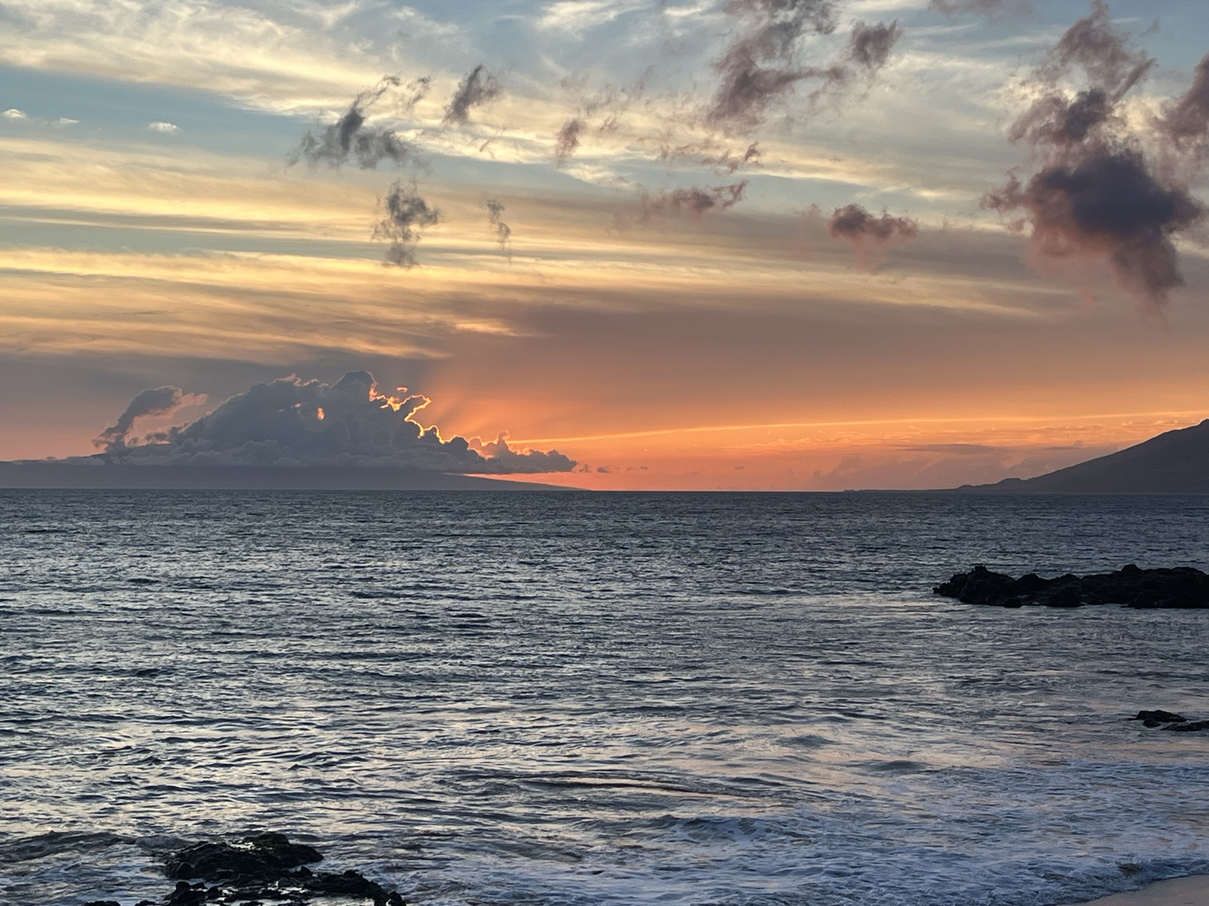 Orange afterglow over West Maui and Kaho'olawe from the lava coastline