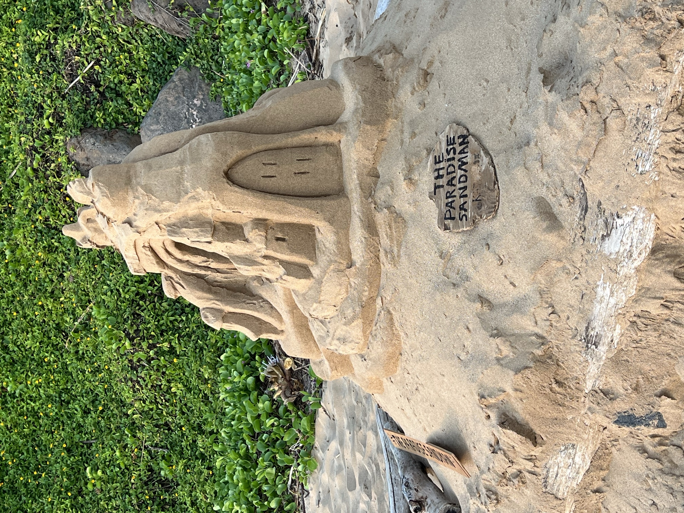 The Paradise Sandman — full view of the signed sand sculpture on Kama'ole beach