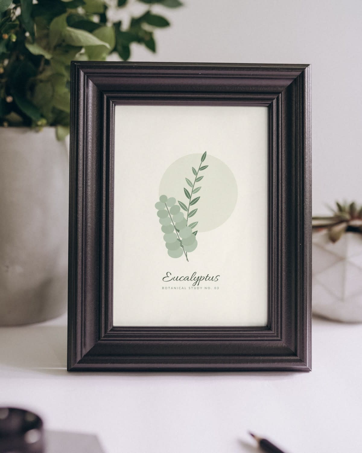 Sage Green Botanical Print framed on a shelf