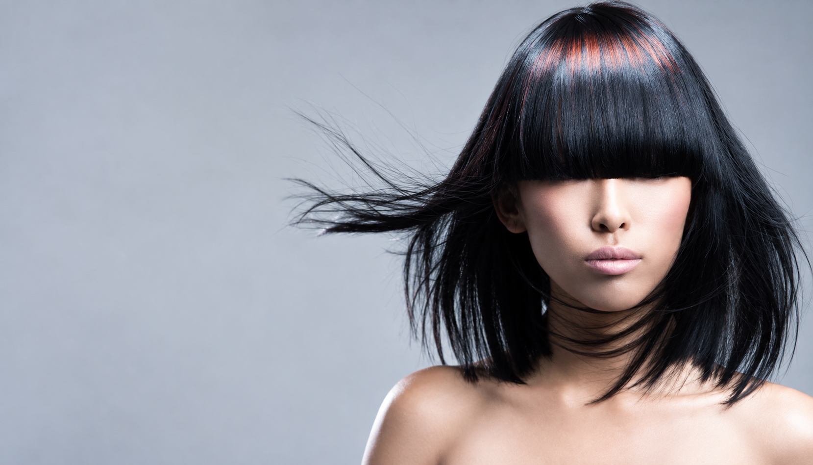 Creative professional hairstyle featuring precision cutting, strong shape and modern salon technique.