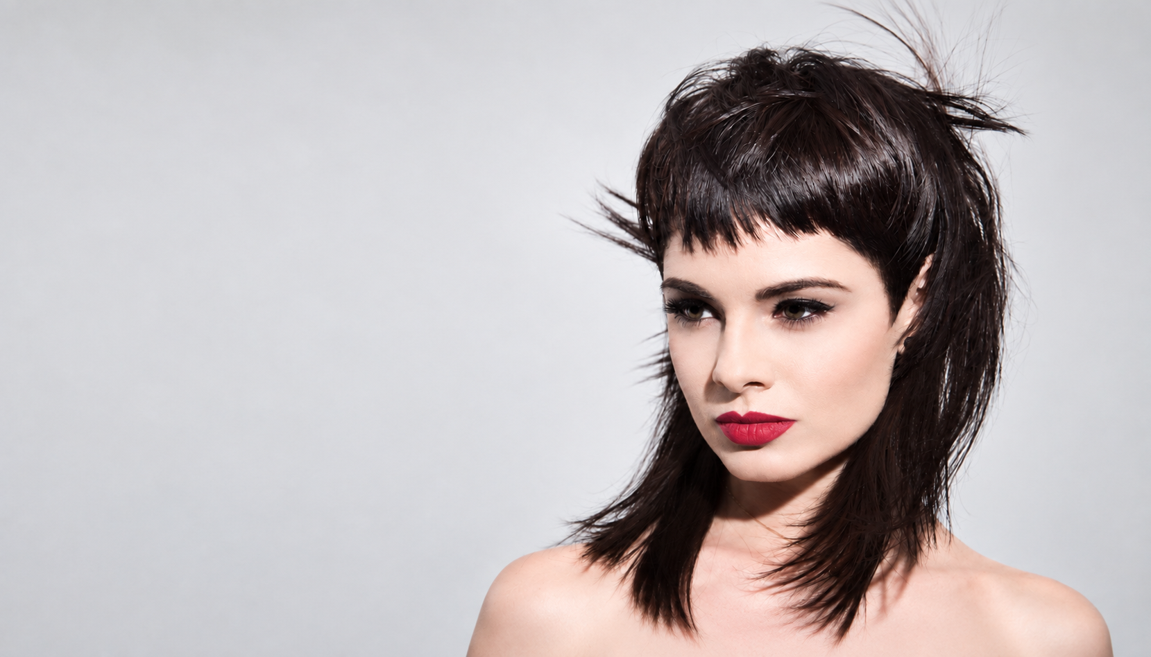 Creative professional haircut showcasing shape, texture and modern hair cutting techniques.