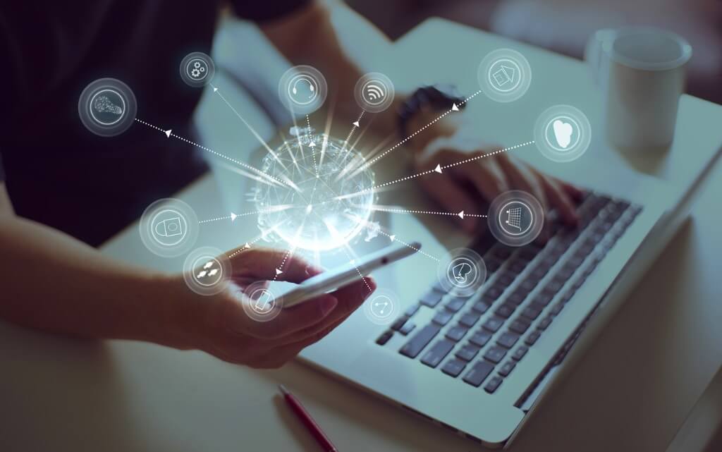 Image of a lap top and phone with overlay illustration showing how connected they are