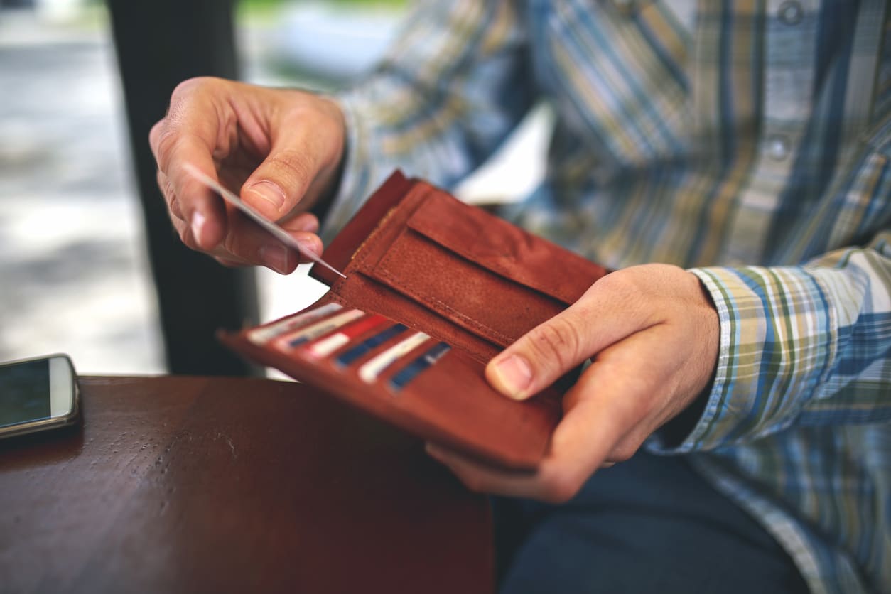 Man buys with a credit card.