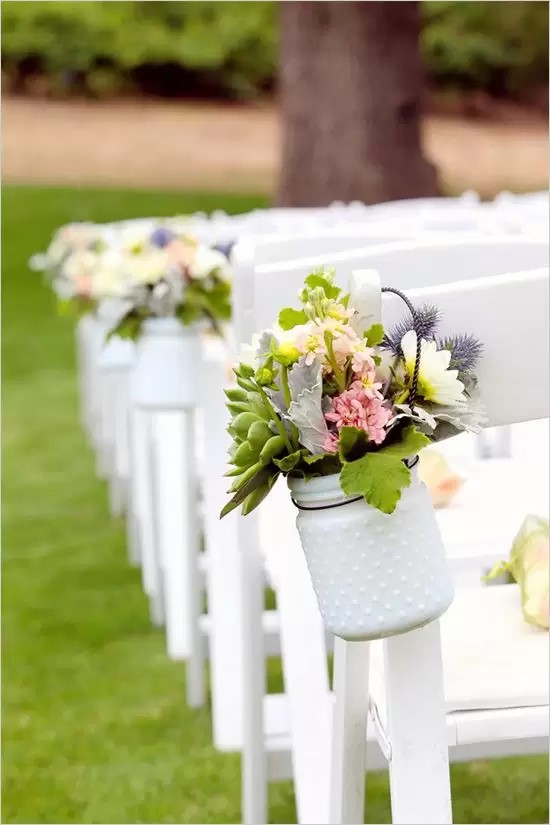 Floral arrangement hanging on a Folding Chair